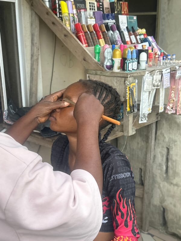 Informal street makeup session in Badagry, Nigeria