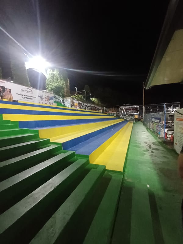 Colorful painted stadium steps glowing under floodlights in Varna