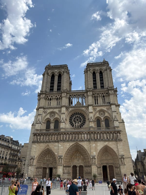 Up close with Notre Dame's Gothic facade and a nearby astronomical clock