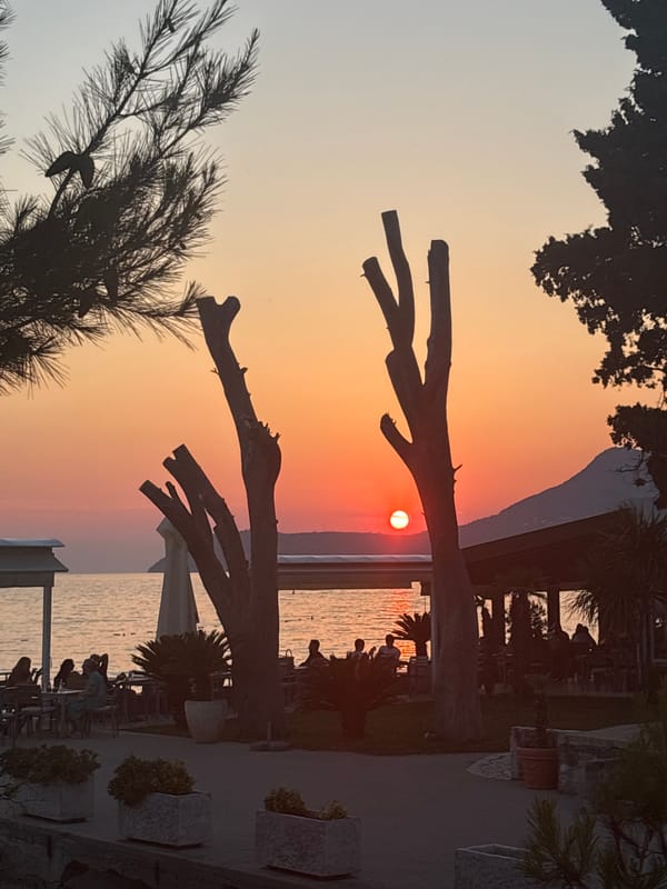 Sunset hour on the pebble beach in Bar, Montenegro