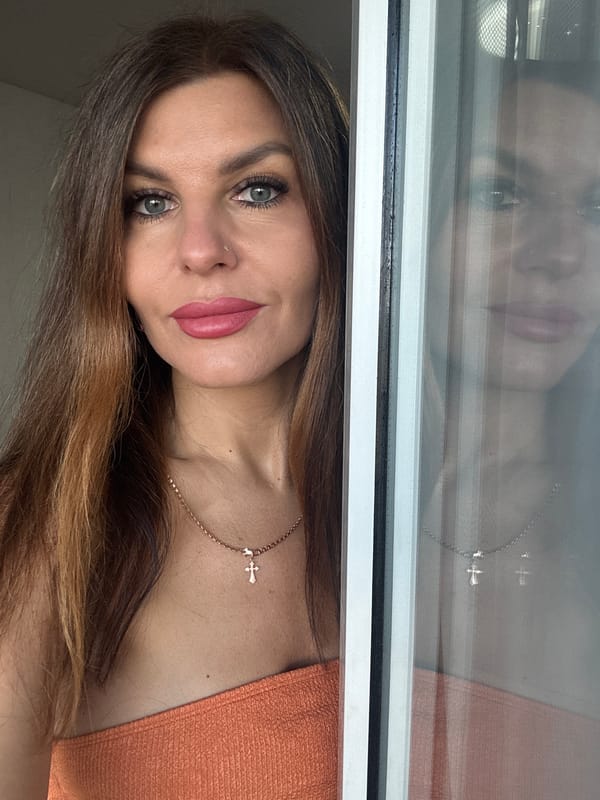 Woman photographs herself indoors in Chaikovsky, Russia