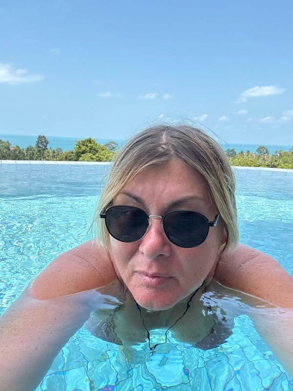 Tourist documents leisurely morning at Thai resort pool