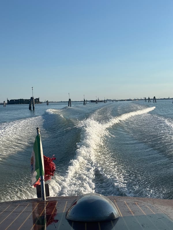 Boat wake on sun-lit Venice canals