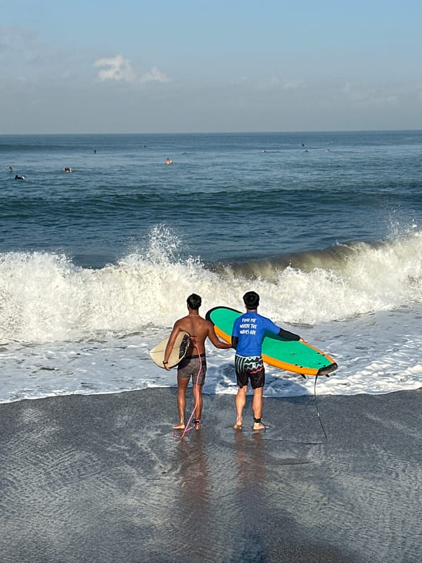 Beach day scenes with surfers and beachgoers in North Kuta