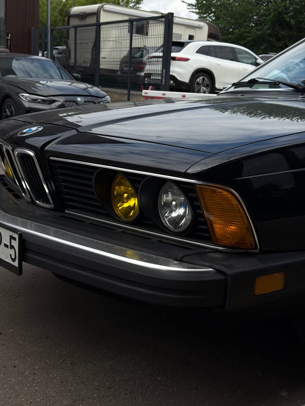 Vintage black BMW E24 coupe parked in central Minsk