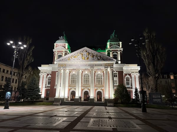 Evening scenes captured around Sofia's National Theatre with corgis