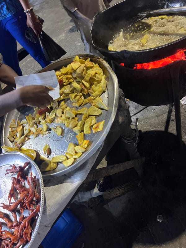 Street food vendor operates cooking stall in Lagos