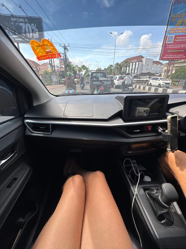 Vehicle interior view captured on Kuta street, Indonesia
