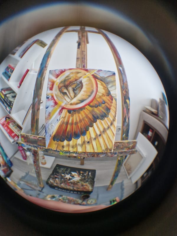 Artist's studio with abstract feather painting documented