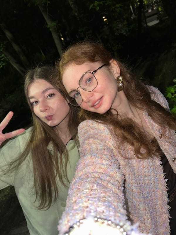 Two friends document evening park visit in Kazan