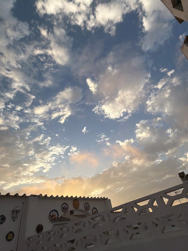Torrevieja sunset evening, clouds, and a Pomeranian indoors