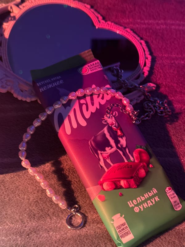 Russian book displayed with jewelry under colored lighting