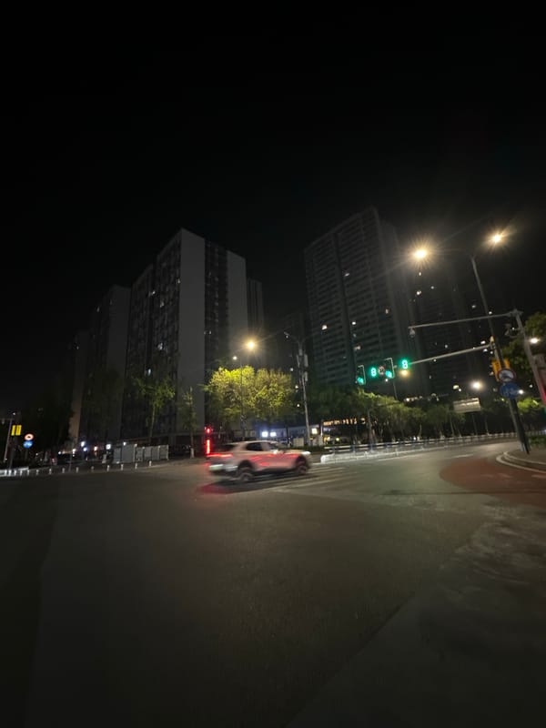 Nighttime street intersection documented in Chongqing High-tech Zone