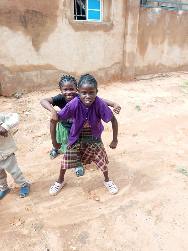 Everyday moments outside a building in Gombe, Nigeria