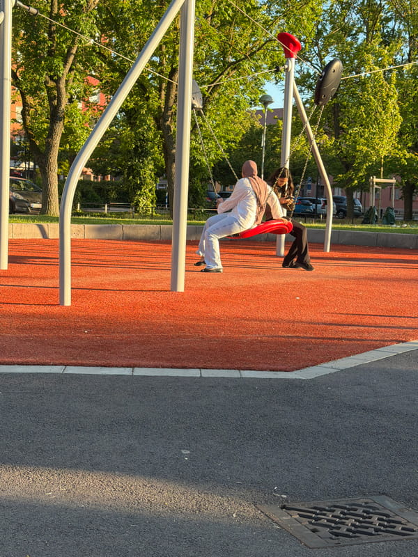 Summer evening at a Helsingborg park playground and basketball court
