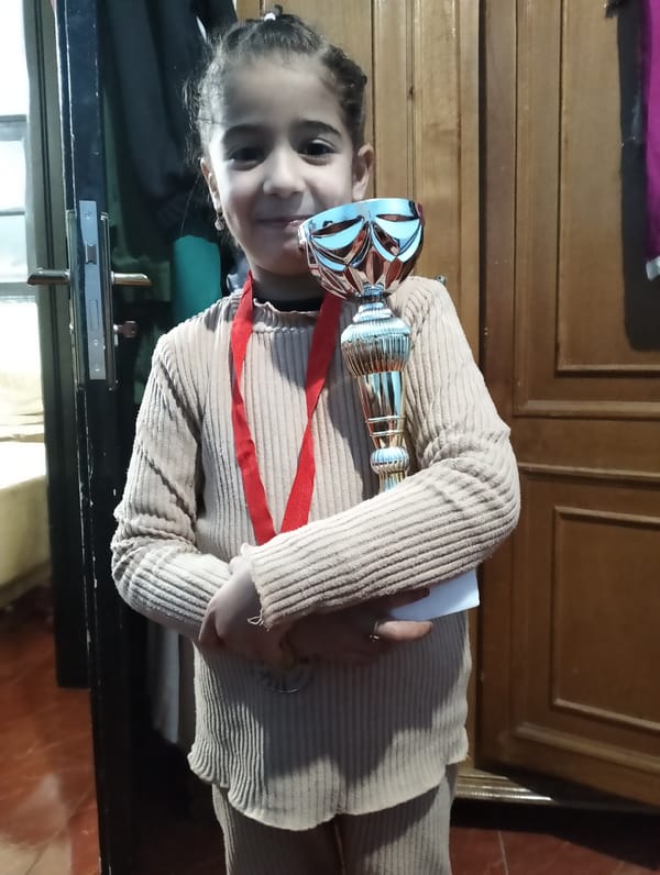 Children celebrate with trophies in Ouaouizert, Morocco streets