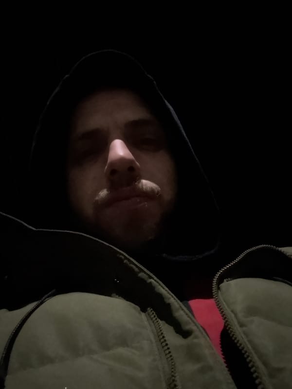 Person in layered clothing spotted looking upward in Samokov