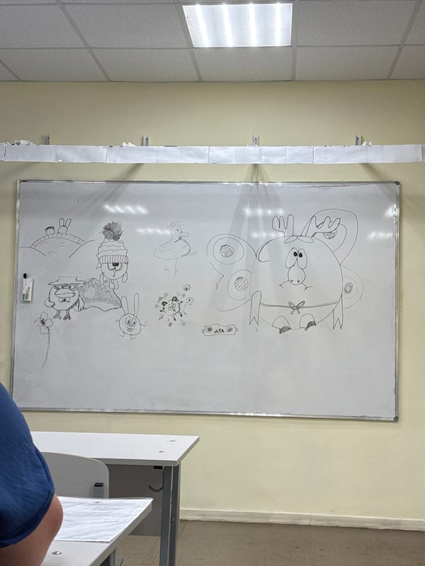 Whiteboard with drawings observed in Zav'yalovo classroom setting