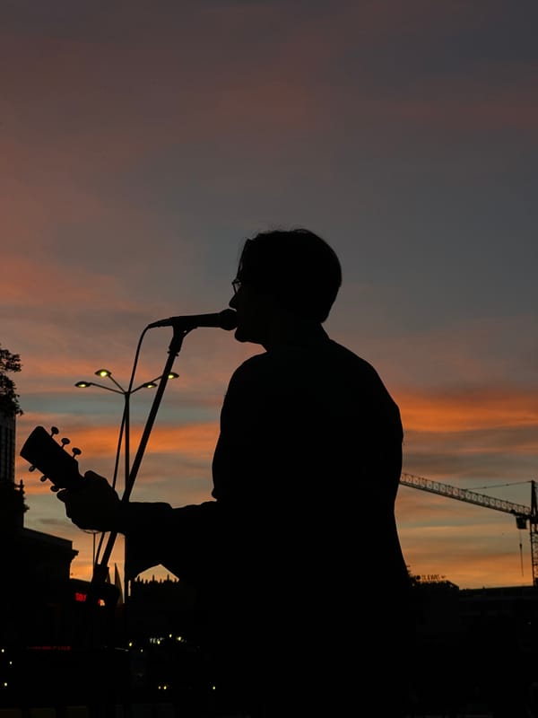 Live music and city skyline at golden hour in Warsaw