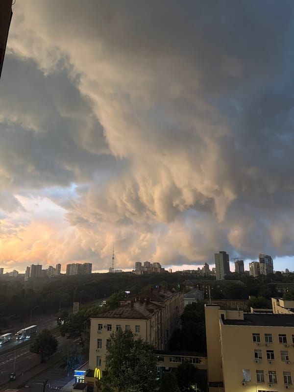 Storm clouds roll over Kyiv's skyline on a June evening