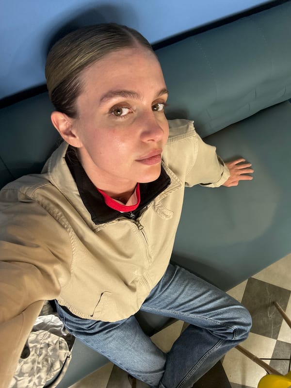 Woman resting on couch in Tbilisi indoor setting