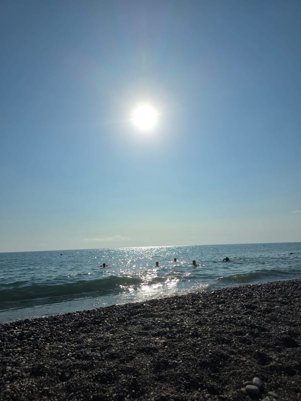 Sunny afternoon on Khostinskiy's Black Sea pebble beach