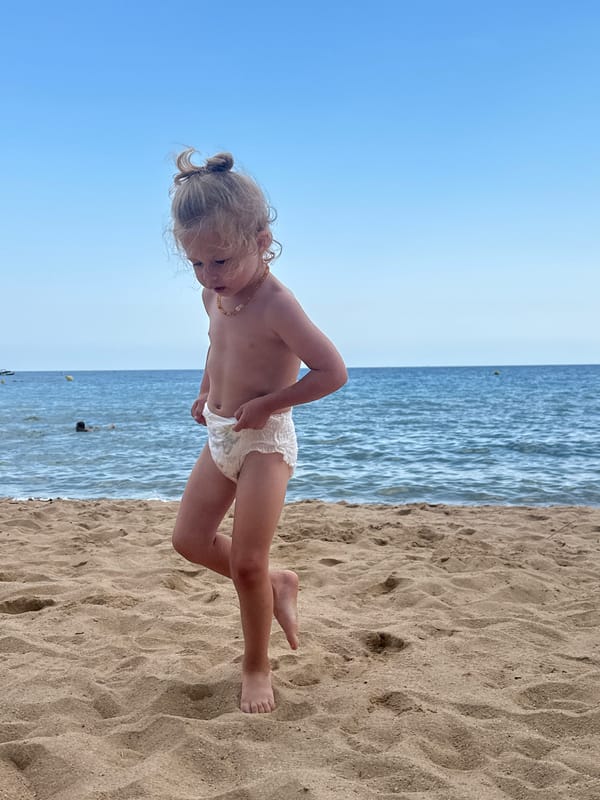 Lazy summer afternoon on the beach at Sant Feliu de Guíxols