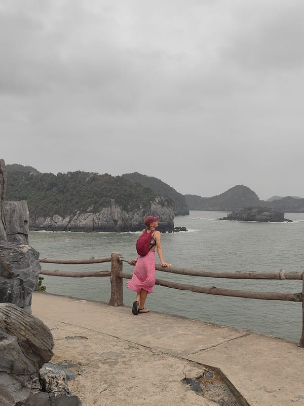 Woman strolls coastal pathway at dawn in Hải Phòng