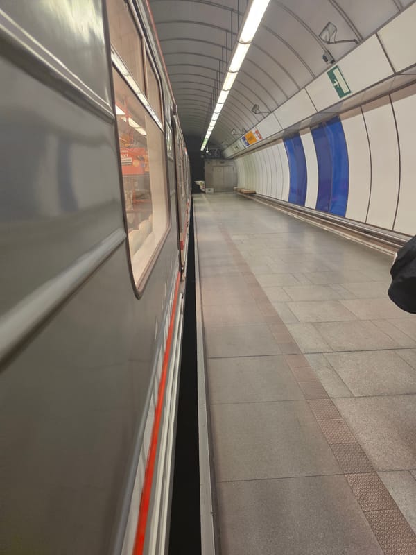 Mixed urban memories: subway station, abstract art, piano display