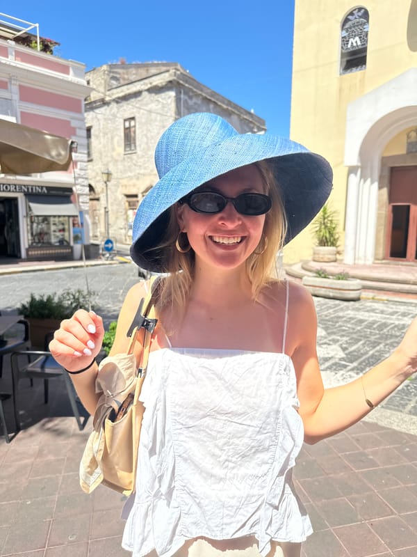 Woman photographed on sunny street in Lipari, Italy