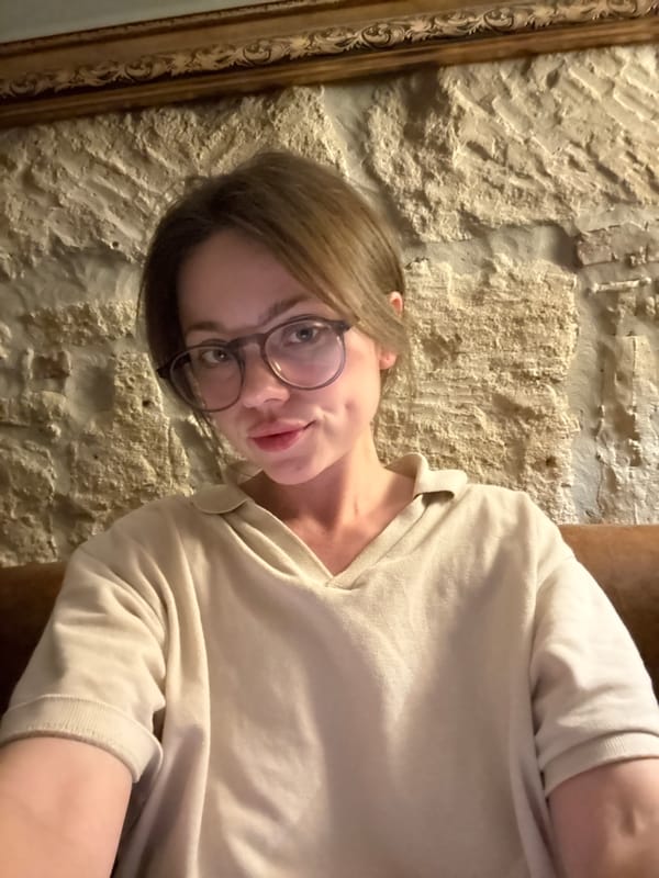 Woman takes casual selfies indoors in Budapest