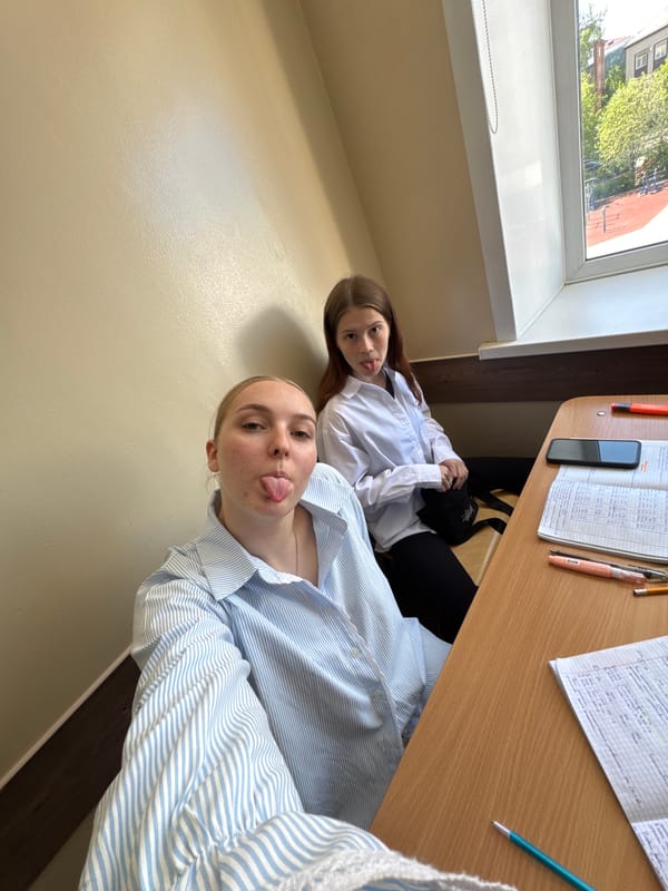 Young women photograph themselves indoors in Perm, Russia