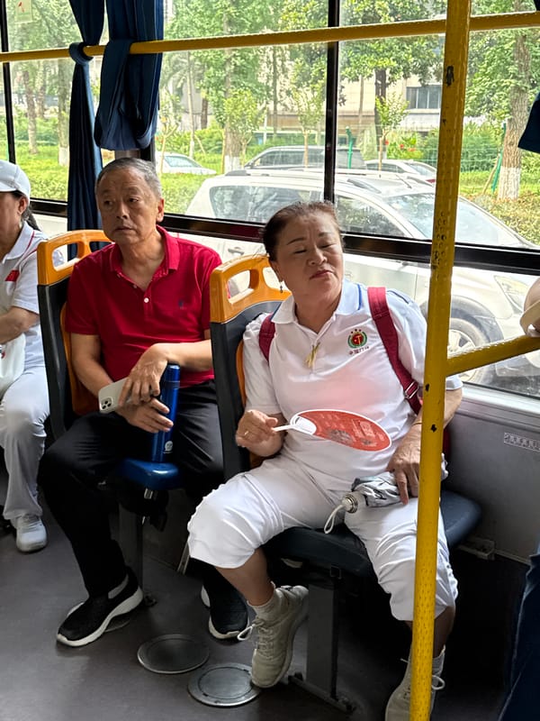 Daily life documented in Jiangjin: bus passengers, street maintenance