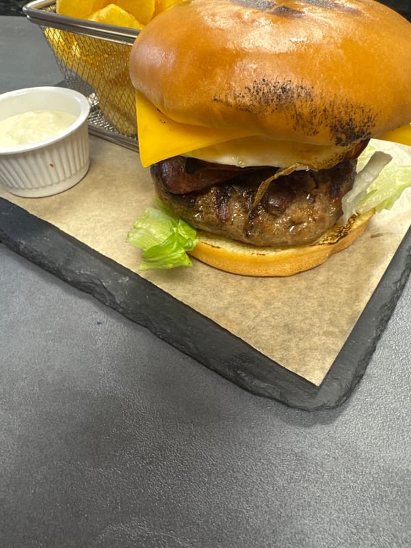 Burger meal photographed on slate tray in Blagoevgrad