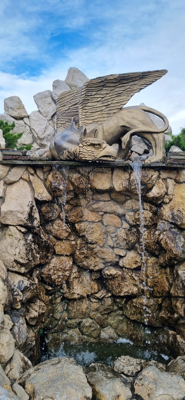 Griffin fountain and dogs observed in Feodosia, Ukraine
