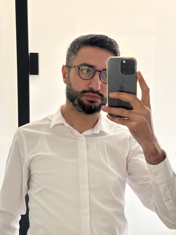 Man takes mirror selfie in Milan indoor location