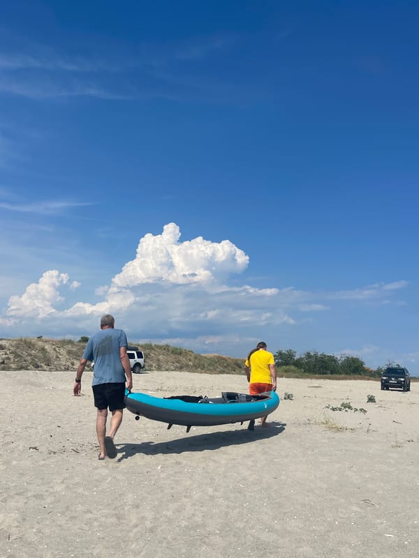 Kayakers and beachgoers enjoy casual afternoon at Agios Georgios