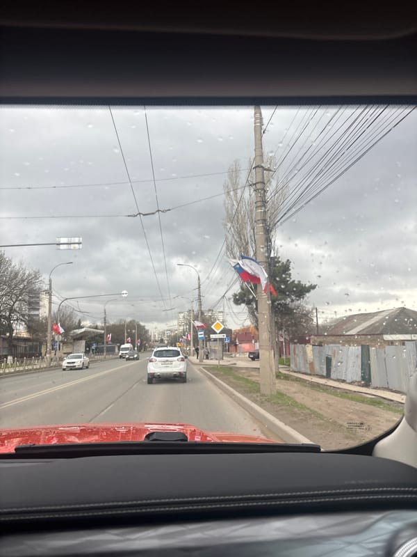 Car journey documented through Simferopol streets during rainy weather