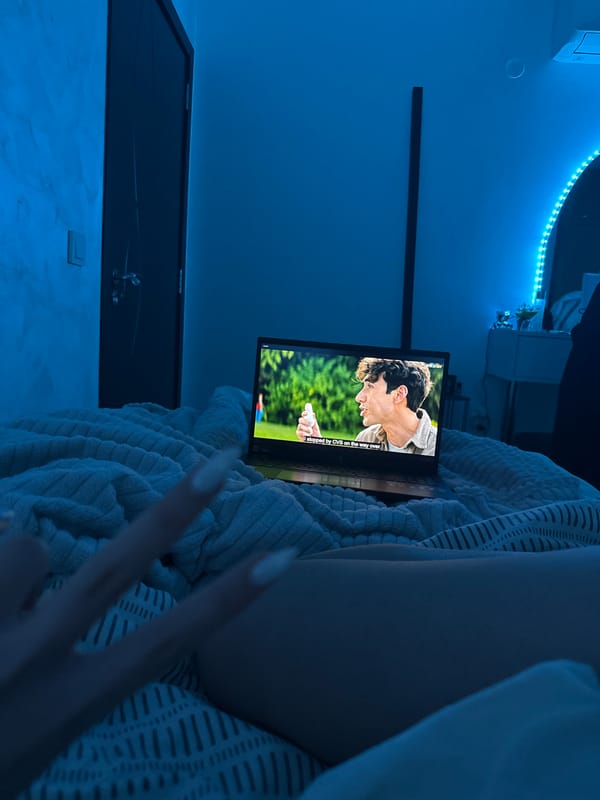 Person watches laptop movies in bed in Blagoevgrad