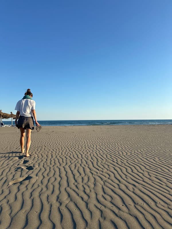 Quiet afternoon on a dark sand beach in Montenegro