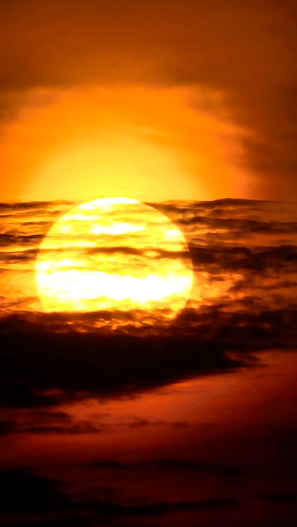 Bright sun breaks through wispy clouds over Asan-si