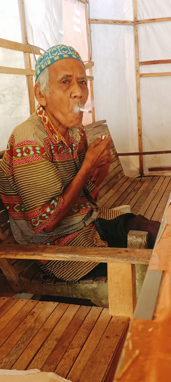 Late-night coffee and cigarettes at a Lhokseumawe warung