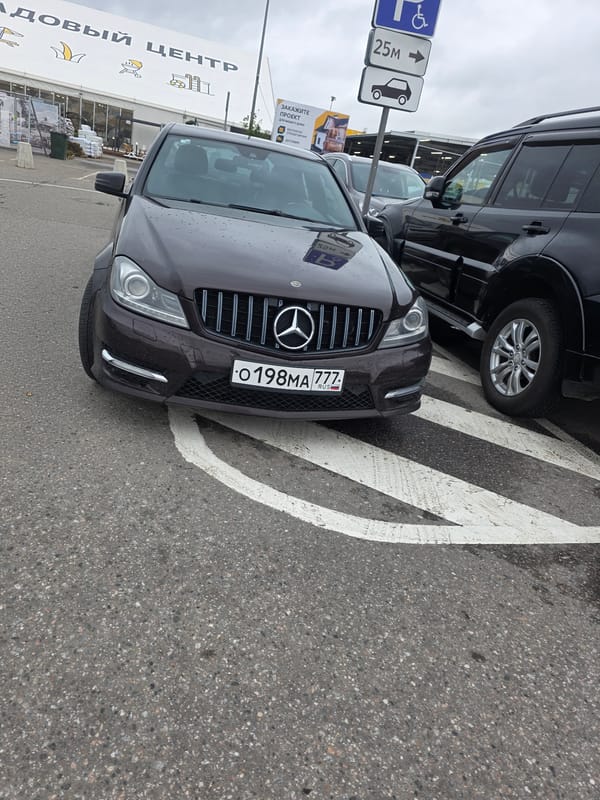 Russian highway and parking lot traffic on a cloudy day