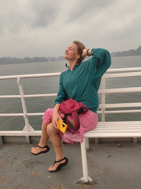 Ferry departs Tuan Chau Ward with passengers photographing scenic views