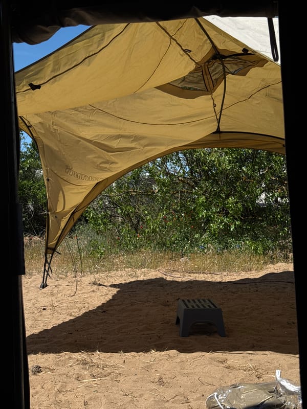 Camper sets up awning at Sozopol campsite
