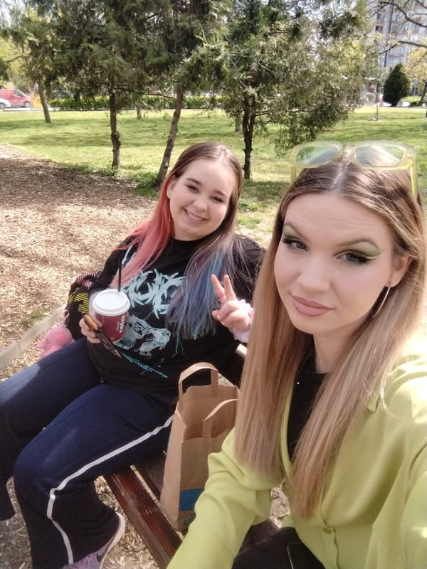 Young women take sunny afternoon photos in Plovdiv park