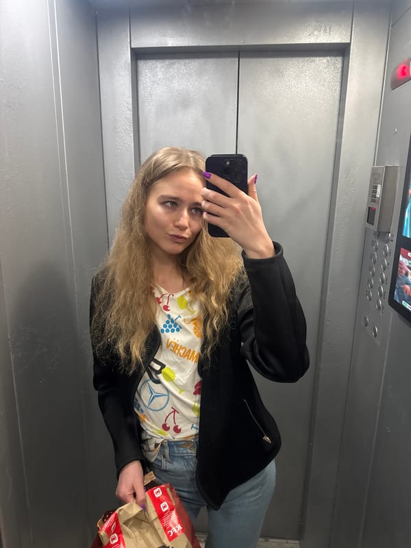 Woman Takes Elevator Selfies While Holding Fast Food Bag