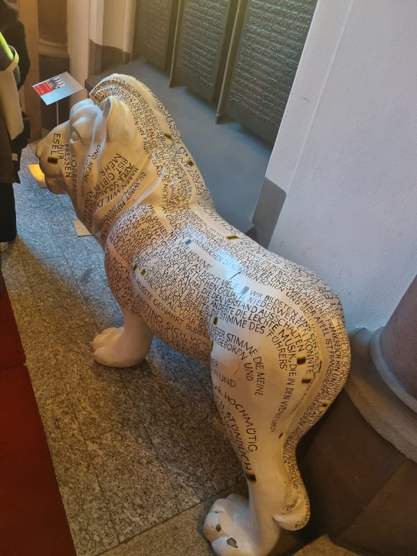 Saarbrücken cafe and graffitied lion statue documented