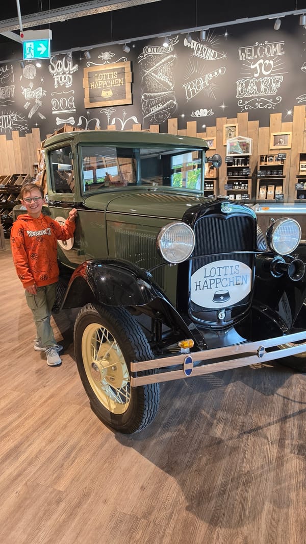 Boy poses with vintage car wearing Dragon Ball Z shirt