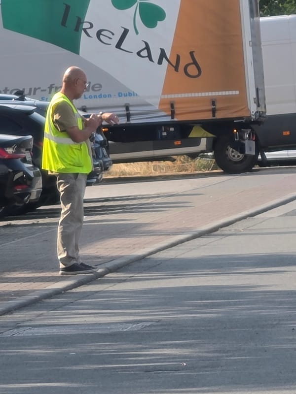 Logistics crew at work in a Frankfurt vehicle lot